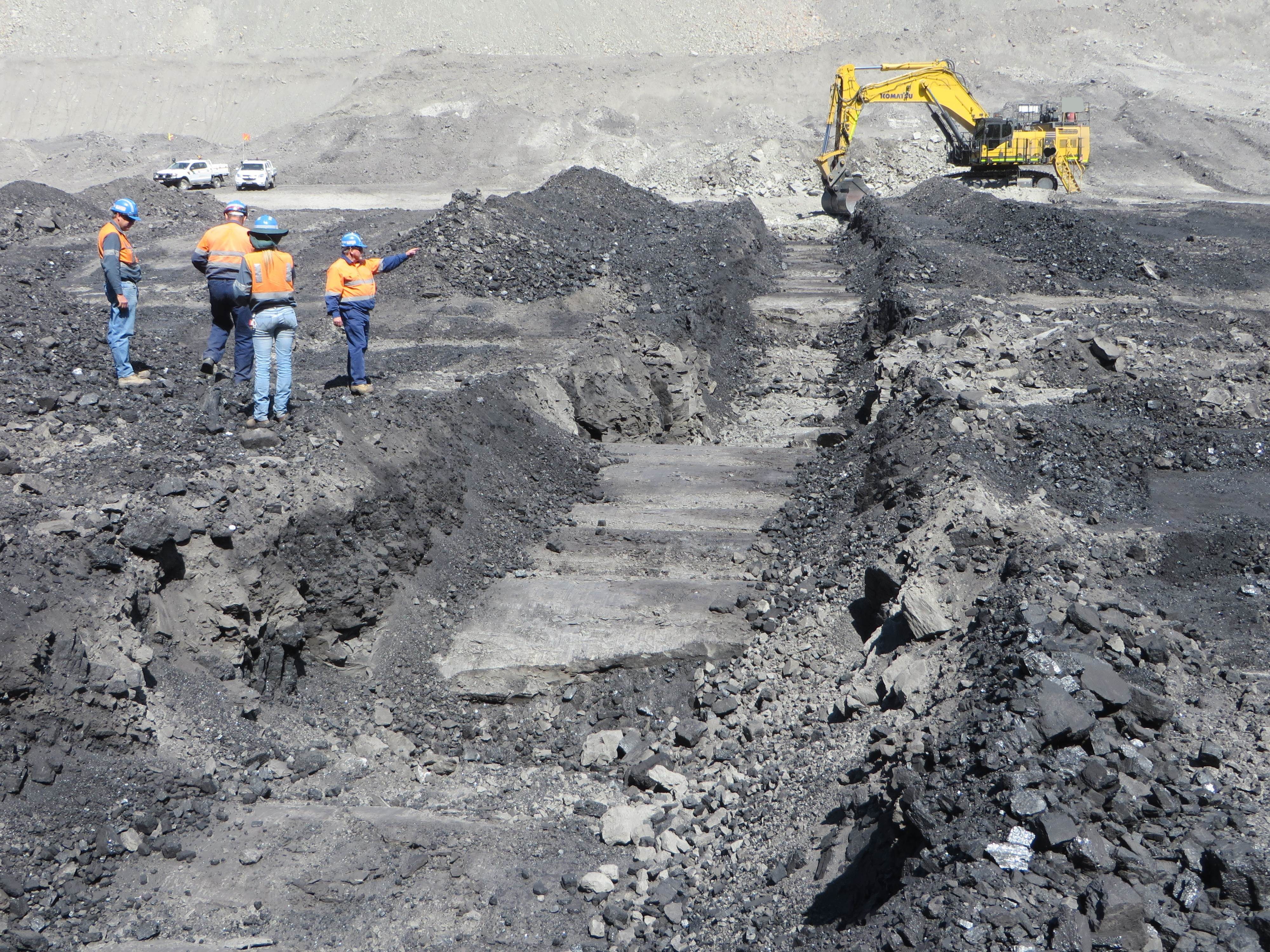 Geologists Inspecting Coal Trenching Program With Operators